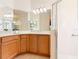 Bright bathroom, featuring a shower, double vanity, and tile floors at 203 Los Gatos Pl, Poinciana, FL 34759