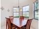 Cozy breakfast nook with a wooden table set for four at 203 Los Gatos Pl, Poinciana, FL 34759