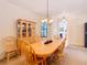 Charming dining room with a wooden table and matching chairs at 203 Los Gatos Pl, Poinciana, FL 34759