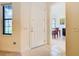 Bright entryway with tile flooring and view into dining area at 203 Los Gatos Pl, Poinciana, FL 34759