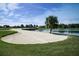 Sand trap on a beautiful golf course next to a pond at 203 Los Gatos Pl, Poinciana, FL 34759