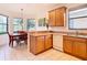 Eat-in kitchen with wood cabinets, a breakfast nook, and tile flooring at 203 Los Gatos Pl, Poinciana, FL 34759