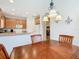 Kitchen with light wood cabinets and breakfast bar at 203 Los Gatos Pl, Poinciana, FL 34759
