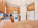 Bright kitchen with ample cabinetry, stainless steel appliances, and tile flooring at 203 Los Gatos Pl, Poinciana, FL 34759