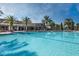 Resort-style lap pool with a large sundeck at 203 Los Gatos Pl, Poinciana, FL 34759