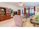 Relaxing living room featuring a cozy seating arrangement and access to a patio at 203 Los Gatos Pl, Poinciana, FL 34759
