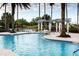 Relaxing pool area with waterfall feature and pergola at 203 Los Gatos Pl, Poinciana, FL 34759
