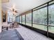 Spacious screened lanai with seating area and ceiling fans at 203 Los Gatos Pl, Poinciana, FL 34759