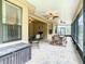 Relaxing screened lanai with multiple seating areas at 203 Los Gatos Pl, Poinciana, FL 34759