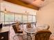 Relaxing screened porch with seating and patio furniture at 203 Los Gatos Pl, Poinciana, FL 34759