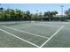 Well-maintained tennis courts with surrounding fencing and shaded seating at 203 Los Gatos Pl, Poinciana, FL 34759
