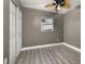 Bedroom with wood-look floors and ceiling fan at 209 Overlook Dr, Clermont, FL 34711