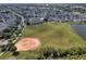 Community baseball field near homes and lake at 217 Farrington Ln, Kissimmee, FL 34744