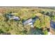 Aerial view of a house with surrounding trees and landscape at 2650 Hilliard Ct, Kissimmee, FL 34744