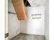 Unfinished attic space with pull-down stairs and shelving at 2650 Hilliard Ct, Kissimmee, FL 34744