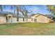 Spacious backyard with view of house's back and sides at 2650 Hilliard Ct, Kissimmee, FL 34744