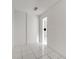Small bedroom with white walls and tiled floors, needs renovation at 2650 Hilliard Ct, Kissimmee, FL 34744