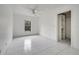 Simple bedroom with tile floor, window, ceiling fan and closet at 2650 Hilliard Ct, Kissimmee, FL 34744