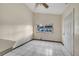 Small bedroom with tiled floor, window, and exterior access at 2650 Hilliard Ct, Kissimmee, FL 34744