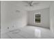 Simple bedroom with tiled floors, a window, and a ceiling fan at 2650 Hilliard Ct, Kissimmee, FL 34744