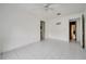 Empty bedroom with tiled floor, ceiling fan, and access to other rooms at 2650 Hilliard Ct, Kissimmee, FL 34744