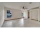 Simple bedroom with tiled floors and two windows at 2650 Hilliard Ct, Kissimmee, FL 34744