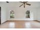 Bedroom with tile flooring and two windows at 2650 Hilliard Ct, Kissimmee, FL 34744