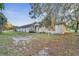 Side view of a ranch home with a large yard at 2650 Hilliard Ct, Kissimmee, FL 34744