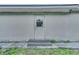 Back exterior door with steps leading to a small patio at 2650 Hilliard Ct, Kissimmee, FL 34744