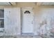 White exterior door with arched window at 2650 Hilliard Ct, Kissimmee, FL 34744