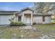 Front view of a fixer-upper ranch home at 2650 Hilliard Ct, Kissimmee, FL 34744