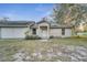 Front view of a ranch-style home with a two-car garage at 2650 Hilliard Ct, Kissimmee, FL 34744