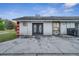 Exterior view of a detached garage or workshop with double doors at 2650 Hilliard Ct, Kissimmee, FL 34744