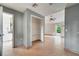 Hallway with tile flooring, open shelving and view to living room at 2650 Hilliard Ct, Kissimmee, FL 34744