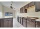 Kitchen with dark wood cabinets and a stove top at 2650 Hilliard Ct, Kissimmee, FL 34744