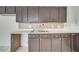 Kitchen with dark wood cabinets and a double sink at 2650 Hilliard Ct, Kissimmee, FL 34744