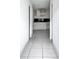 Dated kitchen with white cabinets and tiled floors needs updating at 2650 Hilliard Ct, Kissimmee, FL 34744