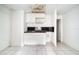 Small kitchen with white cabinets and a worn countertop at 2650 Hilliard Ct, Kissimmee, FL 34744