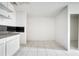 Kitchen area with white cabinets and tiled floors needing renovation at 2650 Hilliard Ct, Kissimmee, FL 34744