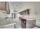 Kitchen with dark wood cabinets, tiled floors, and an island at 2650 Hilliard Ct, Kissimmee, FL 34744
