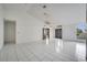 Spacious living room with tile floors and large windows at 2650 Hilliard Ct, Kissimmee, FL 34744