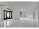 Open concept living room with tile floors and large windows at 2650 Hilliard Ct, Kissimmee, FL 34744