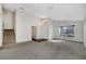 Living room with carpeted floors, staircase, and natural light at 2751 Stanwood Dr, Kissimmee, FL 34743