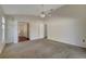 Main bedroom with carpet, ceiling fan and ensuite bathroom at 2751 Stanwood Dr, Kissimmee, FL 34743