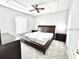 Cozy bedroom featuring neutral walls, plush carpeting, and a large window for natural light at 2949 Zaharias Dr, Orlando, FL 32837