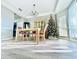 Elegant dining area with decorative light fixture, hardwood floors, and a view of the Christmas tree at 2949 Zaharias Dr, Orlando, FL 32837