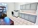 Well-equipped laundry room featuring ample storage space and a modern washer and dryer at 2949 Zaharias Dr, Orlando, FL 32837