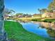 Picturesque water view showcasing a winding stream, complemented by well-maintained lawn and charming homes at 2949 Zaharias Dr, Orlando, FL 32837