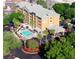 Hotel aerial view showcasing pool and parking at 3000 Maingate Ln # 209, Kissimmee, FL 34747