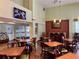 Bright breakfast area with multiple tables and chairs at 3000 Maingate Ln # 209, Kissimmee, FL 34747